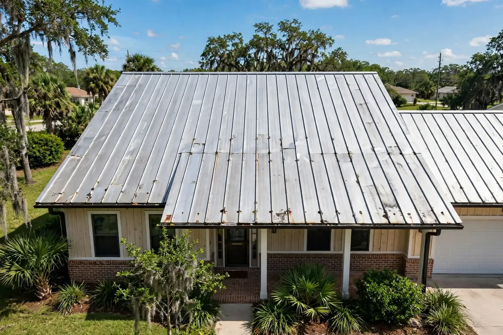 Roofing work related to metal roof repair cost on a home in Beaumont, Texas